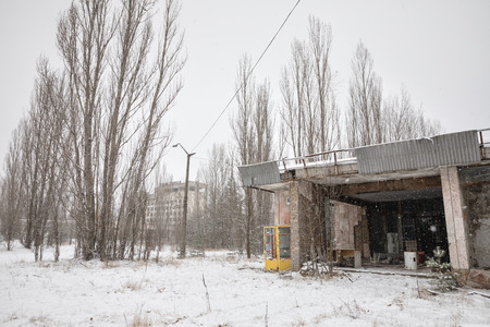 CHERNOBYL REG, UKRAINE - Nov 29, 2016: Chernobyl Exclusion Zone. Lost city. Ruins of buildings in the abandoned city of Pripyat. Winter in zone of exclusion. Zone of high radioactivityのeditorial素材