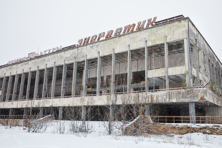 CHERNOBYL REG, UKRAINE - Nov 29, 2016: Chernobyl Exclusion Zone. Lost city. Ruins of buildings in the abandoned city of Pripyat. Winter in zone of exclusion. Zone of high radioactivityのeditorial素材
