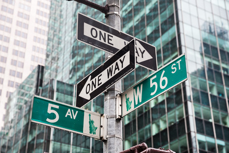 NEW YORK, USA - May 01, 2016: Street signs for Fifth avenue and W 56 st crossroad in New York City, Manhattan, USAのeditorial素材