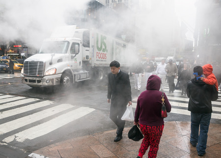 NEW YORK, USA - May 03, 2016: Manhattan street scene. Cloud of vapor from the subway on the streets of Manhattan in NYC. Typical view of Manhattanのeditorial素材