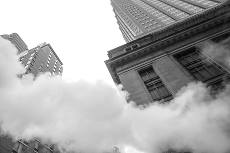 NEW YORK, USA - May 03, 2016: Manhattan street scene. Cloud of vapor from the subway on the streets of Manhattan in NYC. Typical view of Manhattanのeditorial素材