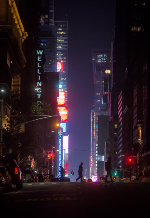 NEW YORK, USA - May 03, 2016: New York City streets at night. Lights and shadows of NYC. Lights of...