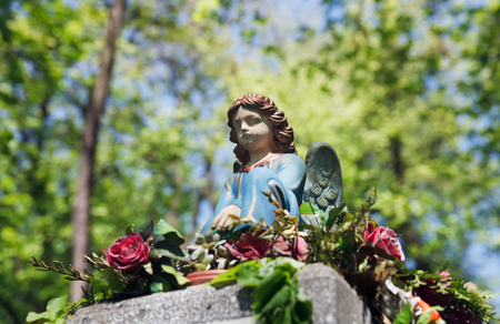 LVIV, UKRAINE - Apr 27, 2016: Old statue on grave in the Lychakivskyj cemetery of Lviv, Ukraine. Officially State History and Culture Museum-Preserve - Lychakiv Cemeteryのeditorial素材