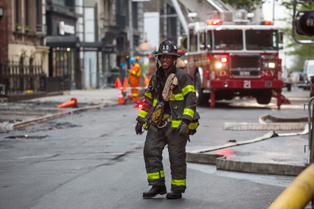 NEW YORK, USA - May 02, 2016: Firefighters of New York City after the fire suppression of Manhattans Serbian Cathedral of Saint Sava at 25th and Broadwayのeditorial素材