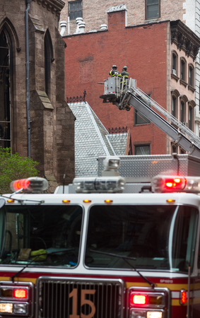 NEW YORK, USA - May 02, 2016: Firefighters of New York City after the fire suppression of Manhattans Serbian Cathedral of Saint Sava at 25th and Broadwayのeditorial素材