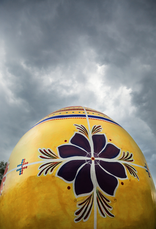 Giant Easter egg on a background of the cloudy skyの写真素材