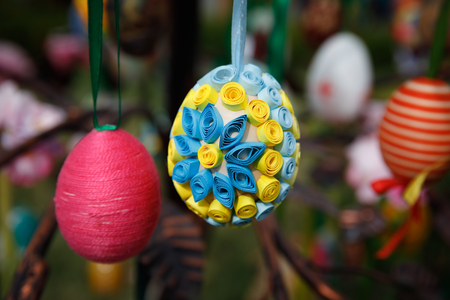 UZHGOROD, UKRAINE - Apr 08, 2017: Folk art and festival of Easter Eggs. Easter holiday. Multicolored Easter eggs hanging on artificial treesのeditorial素材