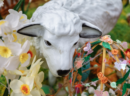 UZHGOROD, UKRAINE - Apr 08, 2017: Folk art and festival of Easter Eggs. Easter holiday. Lamb among the flowers and Easter decorationsのeditorial素材