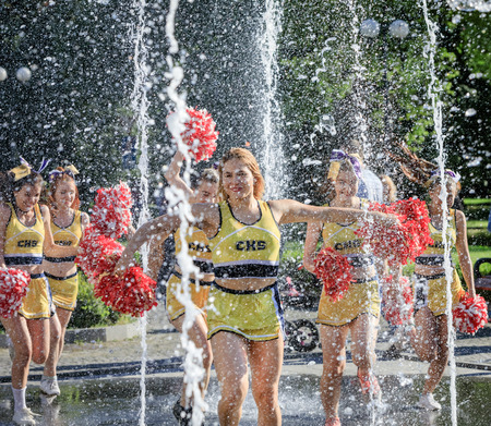 UZHGOROD, UKRAINE - May 28, 2017: Cheerleaders Team. Group of happy Cheerleaders enjoy jogging...