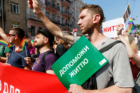 KIEV, UKRAINE - June 18, 2017: Pride Parade In Kiev. Ukrainian gay rights activists take part in a march in Kiev. Text - Health for All and Help Lifeのeditorial素材