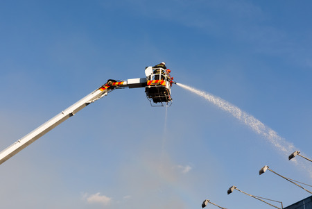KIEV, UKRAINE - Jun 20, 2017: Ukrainian firefighters try to extinguish a fire in a three-story house on Khreshatyk street, the main street in Kiev. Firefighters in actionのeditorial素材