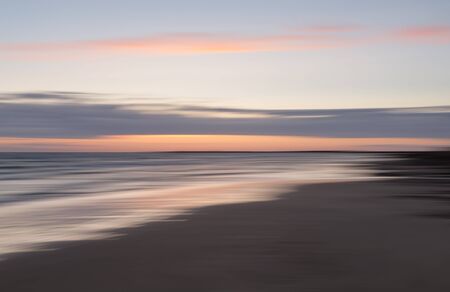 Abstract blurred sea landscape and cloudy sky backgroundの写真素材