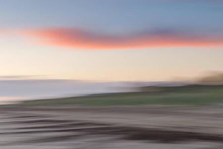 Abstract blurred sea landscape and cloudy sky backgroundの写真素材