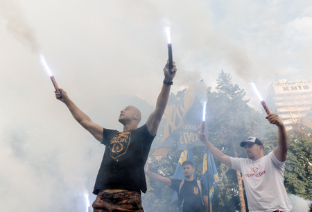 KIEV, UKRAINE - Jul 11, 2017: Ukrainian activists drum empty barrels, burn flares and smoke grenades during a rally in front of the Parliament building. Rally for the removal of parliamentary immunityのeditorial素材