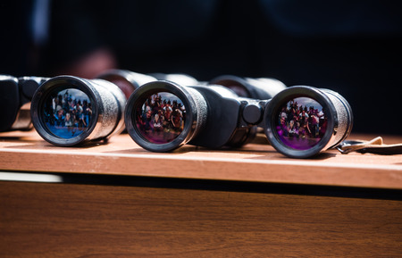 ODZISI, GEORGIA, Jul 19, 2017: Group of journalists reflected in glasses of binoculars during the meeting of the presidents of Ukraine and Georgia on separation line with occupied Tskhinvali regionのeditorial素材
