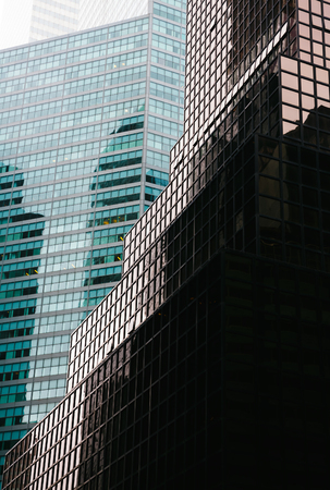 NEW YORK, USA - May 01, 2016: Manhattan modern architecture. Manhattan is the most densely populated of the five boroughs of New York City. Light and shadowsのeditorial素材