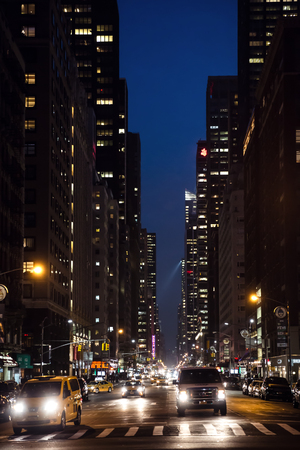 NEW YORK, USA - May 03, 2016: New York City streets at night. Lights and shadows of NYC. Lights of advertising on streets of Manhattan at night.のeditorial素材