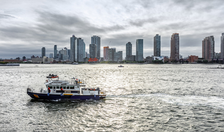 NEW YORK, USA - Sep 20, 2017: NYPD boat patrolling East River during the 72th session of the UN General Assembly in New York Cityのeditorial素材