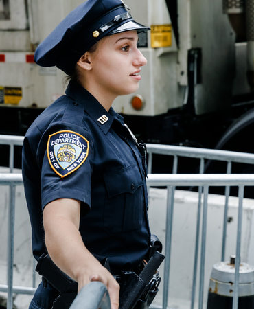 NEW YORK, USA - Sep 21, 2017: Police officers performing his duties on the streets of Manhattan. New York City Police Department (NYPD) is the largest municipal police force in the United Statesのeditorial素材