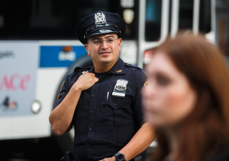 NEW YORK, USA - Sep 21, 2017: Police officers performing his duties on the streets of Manhattan. New...