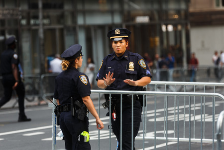 NEW YORK, USA - Sep 21, 2017: Police officers performing his duties on the streets of Manhattan. New...
