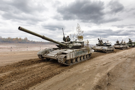 ZHYTOMYR Reg, UKRAINE - Oct. 14, 2017: Column of tanks. Combat training of the Armed Forces of Ukraine in the training center of Zhytomyr region.のeditorial素材