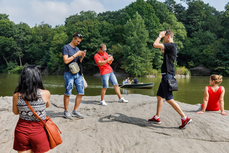 NEW YORK, USA - Sep 17, 2017: New Yorkers and tourists are resting in the central park of NYC. Central Park is an urban park in Manhattan between the Upper West Side and Upper East Sideのeditorial素材