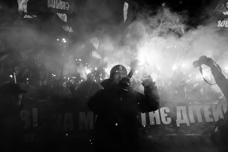 KIEV, UKRAINE - Jan. 01, 2018: Ukrainian nationalist activists mark the 109th birth anniversary of...