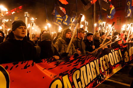 KIEV, UKRAINE - Jan. 01, 2018: Ukrainian nationalist activists mark the 109th birth anniversary of...