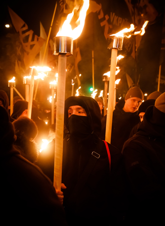 KIEV, UKRAINE - Jan. 01, 2018: Ukrainian nationalist activists mark the 109th birth anniversary of...