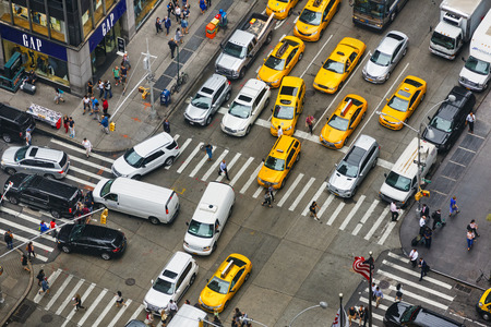 NEW YORK, USA - Sep 18, 2017: Traffic of Manhattan. Yellow taxis and other cars at the crossroads of...