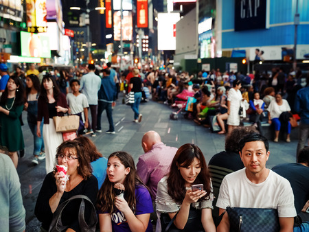 NEW YORK, USA - Sep 17, 2017: Manhattan street scene. Americans and tourists walk and relax on Times Square in New York City in evening timeのeditorial素材