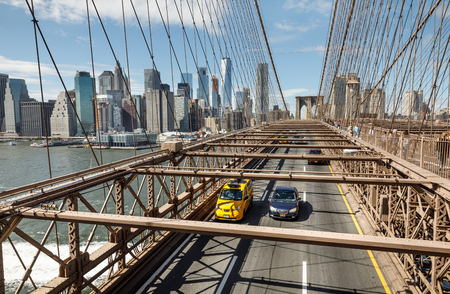 NEW YORK, USA - Sep 22, 2017: Brooklyn Bridge and Financial District in New York City. Rush hour traffic of cars on the Brooklyn Bridge vehicle roadのeditorial素材