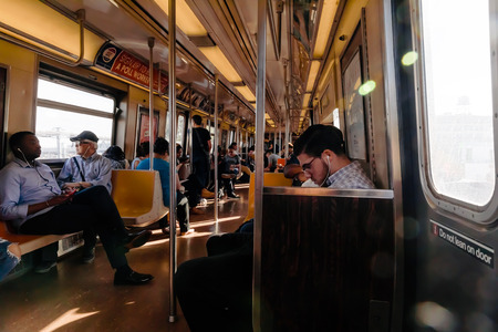 NEW YORK, USA - Sep 22, 2017: New York City Subway. Passengers in the subway train car. NYC Subway...