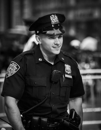 NEW YORK, USA - Sep 21, 2017: Black and white image of police officers performing his duties on the streets of Manhattan. NYC Police Department (NYPD) is the largest municipal police force in USのeditorial素材