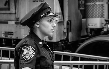 NEW YORK, USA - Sep 21, 2017: Black and white image of police officers performing their duties on...