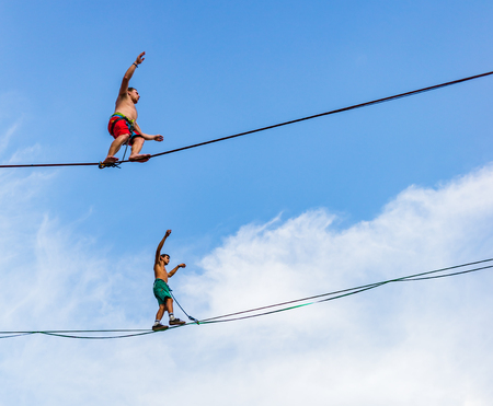 Lublin, Poland - Jul 27, 2018: Rope walkers at urban highline festival placed in city space of Lublin. Lublin is the ninth largest city in Poland.のeditorial素材