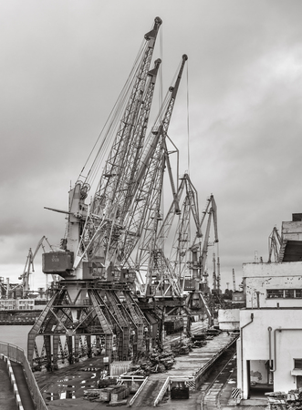 Odessa, Ukraine - Sep 10, 2018: Marine Industrial Commercial Port. Industrial zone of Odessa sea port. Container cranes. Cargo container terminal of sea freight industrial port.のeditorial素材