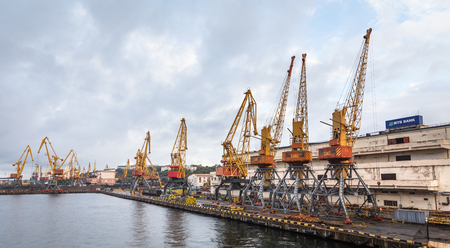 Odessa, Ukraine - Sep 10, 2018: Marine Industrial Commercial Port. Industrial zone of Odessa sea port. Container cranes. Cargo container terminal of sea freight industrial port.のeditorial素材