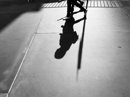 Light and shadows in New York City. Shadows of people walking street in morning lightの写真素材