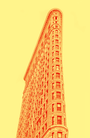Duotone image of Flatiron Building in NYC. Originally the Fuller Building, is a triangular...