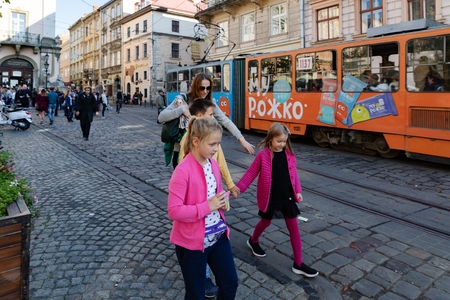 Lviv, Ukraine - Oct 13, 2018: Streets and architecture of the old  Lviv city on a sunny autumn day. Lviv city and Lviv old town with peopleのeditorial素材