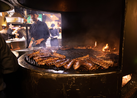 Lviv, Ukraine - Oct 13, 2018: Arsenal Ribs And Spirits. Medieval Themed restaurant near the armoury. Very popular place among tourists. Motion blurred image.のeditorial素材