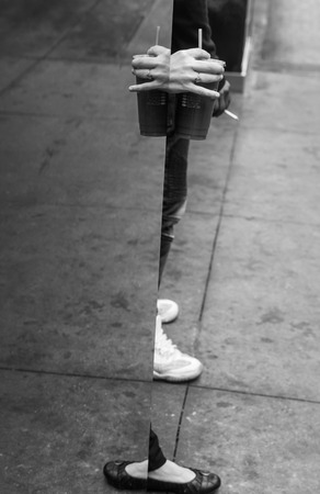 New York, USA - May 03, 2016: Coffee break in the streets of New York City. Hand of a woman with a...
