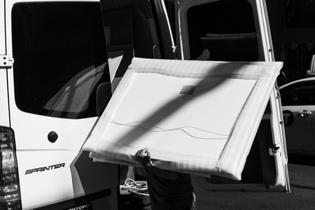 New York, USA - Sep 23, 2017: Manhattan street scene. Delivery service. Workers from the delivery...