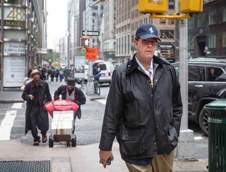 NEW YORK, USA - May 03, 2016: Madison avenue in NYC. Manhattan street scene. Americans are in a hurry about their business.のeditorial素材