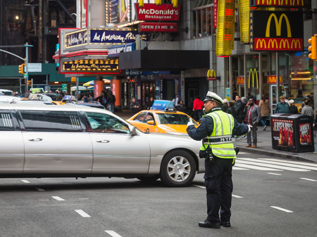 NEW YORK, USA - May 03, 2016: Police officer performing his duties on the streets of Manhattan. New York City Police Department (NYPD) is the largest municipal police force in the United Statesのeditorial素材