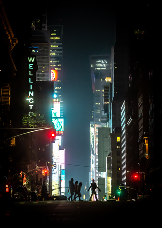 NEW YORK, USA - May 03, 2016: New York City streets at night. Lights and shadows of NYC. Lights of advertising on streets of Manhattan at night.のeditorial素材