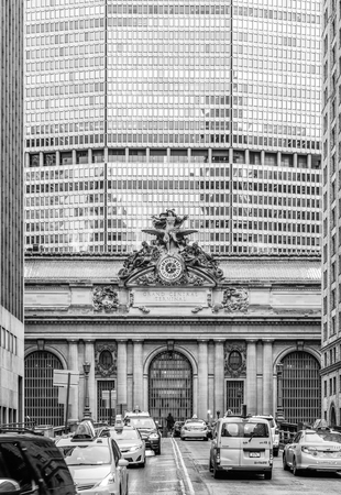 NEW YORK, USA - May 04, 2016: Black and white image of  the Facade of Grand Central Terminal in New York City with office building on the background. Taxi traffic on the way to Grand Central Terminalのeditorial素材