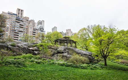 NEW YORK, USA - May 04, 2016: Central Park and Manhattan Skyline. Midtown Manhattan skyline view from Central Park on an overcast day. Rock at Central Parkのeditorial素材